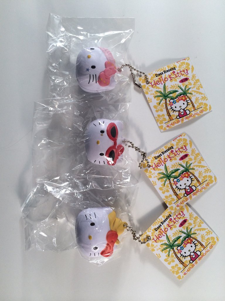 Cross Dressing Hello Kitty Head Squishy with Tag and Chain